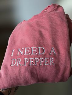 Embroidered "I need a Dr. Pepper Sweatshirt, minimalist funny Crewneck, Embroidered Crewneck Shirt, for Fall or Winter Seasons! This embroidered "I Need A dr. pepper" Sweatshirt is everything. Perfect for showing your Dr. Pepper Love!! Gildan Brand Sweatshirts Unisex  50% Cotton/50% Polyester but SUPER Soft🤗  Pre-shrunk😱  Relaxed fit😋 Care: Machine wash: warm (max 40C or 105F) Tumble dry: low Do not iron directly on the print REFUNDS AND EXCHANGES All items are handmade by myself personally. I Need A Dr Pepper Sweatshirt, Dr Pepper Merch, Dr Pepper Sweatshirt, Dr Pepper Gifts, Dr Pepper Themed Party, Aesthetic Dr Pepper, Dr Pepper Gift Ideas, Cute Items To Buy