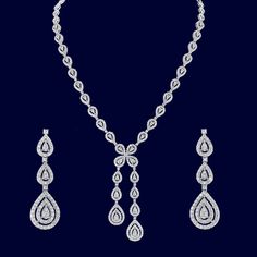 style #1135 For a beautifully classic look, this elegant lariat necklace is breathtaking. The necklace matches a delicate three drop diamond earrings. The diamonds are G color and VS quality, set in 18K white gold. Diamond weight: 7.32 CTW Fine Jewelry Long Drop Necklace For Wedding, Elegant Wedding Lariat Necklace With Diamond Cut, Luxury Drop Lariat Necklace For Formal Occasions, Luxury Drop Lariat Necklace For Formal Events, Luxury Formal Drop Lariat Necklace, Formal Fine Jewelry Dangle Drop Necklace, Formal Dangle Drop Necklace In Fine Jewelry Style, Elegant Cubic Zirconia Lariat Necklace For Formal Occasions, Formal Drop Dangle Necklace In Fine Jewelry Style