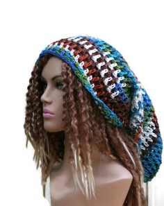 a mannequin head wearing a multicolored crocheted hat