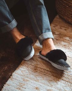 Inspired by our core range, our men's black mule range offering a modern classic on a traditional mule slipper, handmade from luxurious 100% sheepskin. Easy to slip on when you get home after a long day, our super comfortable mules include a 100% woolen lining and gloriously fluffy sheepskin cuff. Sheepers slippers are made by hand, some variations can occur and they are only to be worn indoors. Sheepskin and leather is a natural material so they will naturally flatten more information can be fo Black Rubber Sole Slippers For Indoor Use, Black Indoor Slippers With Rubber Sole, Indoor Black Slippers With Rubber Sole, Comfortable Black Leather Slippers, Comfortable Black Slippers, Comfortable Black Slippers With Leather Sole, Black Leather Footbed Slip-on Slippers, Black Leather Indoor Slippers, Black Closed Toe Indoor Slippers