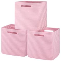 three pink storage baskets stacked on top of each other