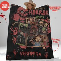 a woman wearing a hat and holding up a blanket with images of horror characters on it