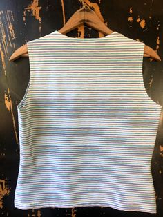 "Cutie vintage 90's pastel blue, white, and purple sparkling striped print tank top. High neckline. Super stretchy fabric. Excellent vintage condition. Tag says: Vue Point, by Jordan. Made in the USA. Size small. Measurements laying flat: fabric stretches. Armpit to armpit: 18\" Length: 20\"" Striped Stretch Tank Top, Spring Sleeveless Tank Top With Vertical Stripes, Sleeveless Vertical Stripes Tank Top For Spring, Sleeveless Striped Tank Top For Spring, Stretch Sleeveless Striped Top, Striped Sleeveless Stretch Top, White Sleeveless Top With Vertical Stripes, Sleeveless Striped Stretch Tops, Blue Fitted Tops With Vertical Stripes