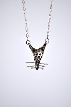 Embrace the unconventional with our Rat Necklace, a whimsical and quirky piece of handmade jewelry that celebrates the unique charm of these often misunderstood creatures. 🐀💫 Crafted with care and attention to detail, this silver necklace features a black patina rat head pendant, exuding an aura of mystery and intrigue. 🖤✨ But what sets this necklace apart is the shiny silver star adorning one eye, reminiscent of the iconic style of David Bowie. 🌟⚡️ Whether you're drawn to its quirky design Whimsical Necklaces For Gifts, Artsy Sterling Silver Pendant Necklace, Unique Sterling Silver Necklaces With Artistic Design, Quirky Multicolor Jewelry For Gifts, Unique Sterling Silver Necklace With Artistic Design, Artsy Silver Necklace With Unique Variations, Unique Artistic Design Necklaces, Artistic Necklace With Unique Design For Gift, Whimsical Nickel-free Necklaces For Jewelry Making