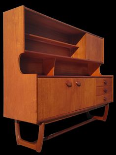 an old wooden dresser with drawers on it