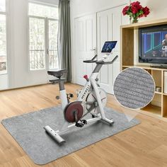 an exercise bike in front of a flat screen tv