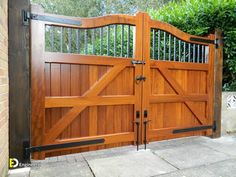 a large wooden gate with iron bars on it