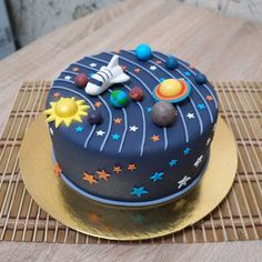 a space themed birthday cake on a table