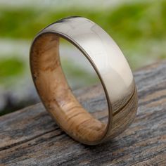 a wooden ring with white ceramic inlay