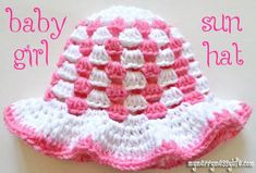 a crocheted pink and white hat with the words happy mother's day on it