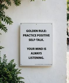 a sign on the side of a building that says golden rules practice positive self - talk your mind is always listening