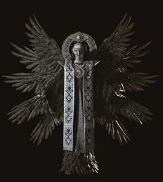 an image of a statue with wings on it