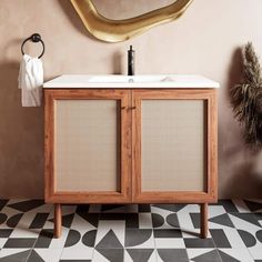 a bathroom with a sink and mirror on the wall