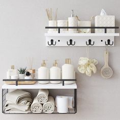 a shelf with towels, soaps and other items on it