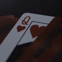 playing cards with the letter q on them