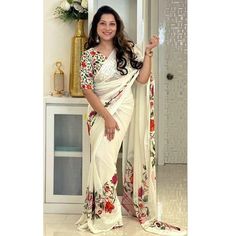 Off White colored saree is made from georgette fabric which is highlighted with beautiful floral digital printed work as shown. comes along with unstitched digital printed georgette blouse which you can customise as per your design/style. Occasion - You can wear this saree for festive and functions, outing and get-together. Note:- the actual product may differ slightly in color and design from the one illustrated in the images when compared with computer or mobile screen. Measurements: Saree : G Traditional White Pre-draped Saree With Floral Print, Traditional Printed Georgette Saree, Traditional Georgette Printed Saree, Printed Georgette Blouse Piece For Saree, Navratri Georgette Saree With Digital Print, Traditional Printed Georgette Dupatta, Fitted Georgette Saree With Digital Print, White Georgette Blouse For Navratri, White Georgette Blouse Piece For Navratri