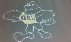 an oru logo is drawn on the back of a t - shirt