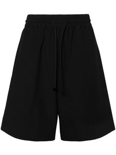 black cotton ripstop texture elasticated waistband with internal drawstring two side inset pockets side slits wide leg knee-length When buying this unisex item, keep in mind that it is graded in standard men's sizing. Baggy Black Shorts, City Shorts, Black Knees, Balenciaga Triple S, Comfy Shorts, Summer Beach Wear, Short Suit, Long Shorts, Sweaters Knitwear