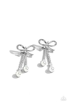 Adorned in sparkling white rhinestones, high-sheen bands of silver curl and loop into a stunning bow charm, creating a classy statement at the ear. White rhinestones encased in scalloped silver fittings, featuring white pearls that slowly increase in size dangle from the bow charm adding a refined tassel to the stunning display. Earring attaches to a standard post fitting. Sold as one pair of post earrings. Bow Charm, Latest Jewellery Trends, Paparazzi Accessories, Bow Earrings, White Rhinestone, Latest Jewellery, Paparazzi Jewelry, White Earrings, Pendant Earrings