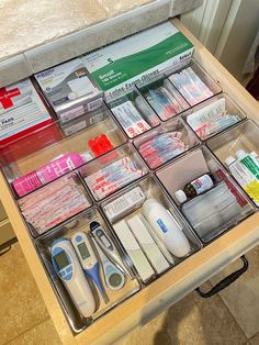 a drawer filled with medical supplies on top of a table