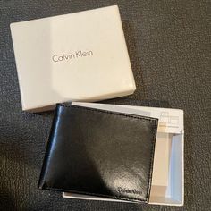 Calvin Klein Leather Passcase. New In Box. Classic Black Trifold Wallet As Gift, Classic Black Wallet As Gift, Black Calvin Klein Bag For Formal Occasions, Formal Calvin Klein Leather Bag, Black Wallets For Everyday Use, Elegant Calvin Klein Business Bags, Calvin Klein Black Business Bags, Calvin Klein Black Formal Bag, Black Rectangular Calvin Klein Bag