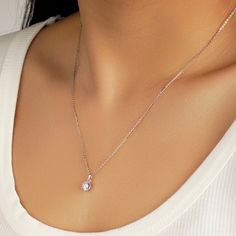 A beautiful diamond is prong-set in this elegant pendant style, which glides smoothly along a lustrous chain. Style ID: N210059SWLM0118Metal: SilverMetal Color: WhiteRhodium Finish: YesNecklace Length: 18inStone(s): MoissaniteTotal Weight (CT. T.W.): 1.22ctCenter Stone T.W.: 1ctStone Dimension: 6.5mmStone Shape: RoundStone Color: DStone Setting: Prong Set Solitaire Diamond Pendant, Round Solitaire, Elegant Pendant, Solitaire Diamond, Diamond Pendant Necklace, Necklace For Women, Diamond Solitaire, Diamond Pendant, Prong Setting