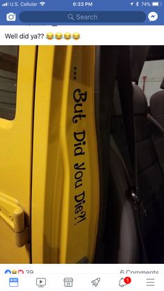 the back door of a yellow vehicle with writing on it