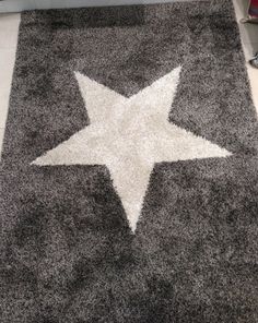 a carpet with a white star on it