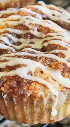 a close up of a muffin with icing on it's cooling rack