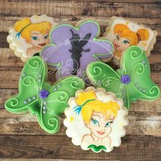 some decorated cookies with tinkerbells on them