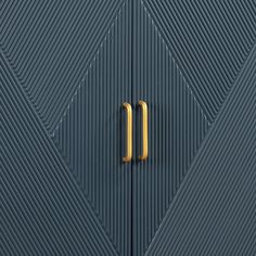 a close up of a blue door with a gold handle on it's side