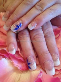 White sculptured acrylic tips with blue freehand nail art Side Flower Nail Design, French Manicure With Blue Flower, Blue Flower On Nails, French Nails With Blue Accent, Wedding Nails Design French, Side Nail Design, Wedding Nails With Blue Accent, French Nails With Blue Design, Blue Flower Nail Art