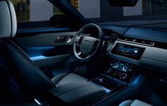 the interior of a modern car is shown at night