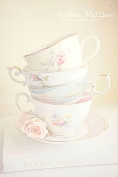 a stack of tea cups and saucers sitting on top of each other