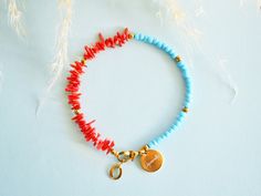 Uplift your looks with this fabulous anklet in the hottest summer hues, that oozes vibrancy and playfulness. A colorful statement bracelet, that will enhance your ankle with it's eye-catching vibe. It looks stunning on its own or layered for extra impact. --------------------- FEATURES ✦ Red coral beads ✦ Light blue glass beads ✦ Gold hematite stones ✦ 100% nickel free stainless steel chain and clasp closure --------------------- FREE standard shipping to Greece over 70€ - Code FREESHIPPING ---- Coral Bracelet For Summer Gift, Trendy Red Beaded Bracelets For Festival, Red Beaded Bracelets For Summer Vacation, Handmade Coral Bracelets For Summer, Adjustable Red Anklet For Beach, Red Bracelet With Colorful Beads For Summer, Vibrant Beaded Bracelets As Summer Gifts, Trendy Red Beaded Bracelets For Beach, Adjustable Red Anklets With Round Beads