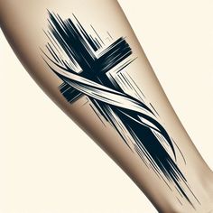 a cross tattoo on the leg of a woman's legs with black ink and brush strokes