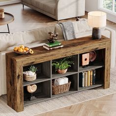 a living room with a couch, coffee table and bookshelf filled with books