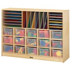 a wooden toy storage unit filled with lots of toys