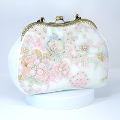 New to our Millennium collection, This beautiful romantic White Embroidered Lace Pink Blue Floral Garden Wedding Bag is made of very fine quality of fabric and metal and it comes with a long Detachable chain for your Big day! Dimensions- length oh the bag is 10 inches and width of the bag is 7 inches. chain measure about 47 inches long. ► ABOUT YOUR ORDER * All items are neatly packaged in our beautiful jewelry boxes and elegant organza bags. * All items are 100% gift-ready. * Each order comes w White Embroidered Rectangular Evening Bag, Evening Embroidered Cream Shoulder Bag, Cream Embroidered Shoulder Bag For Evening, Evening Cream Embroidered Shoulder Bag, White Embroidered Top Handle Bag, Formal White Embroidered Bag, Formal White Embroidered Bags, White Embroidered Bag For Events, Embroidered White Shoulder Bag For Wedding