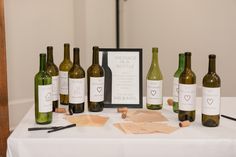 several wine bottles and corks on a table with a sign that says message in a bottle