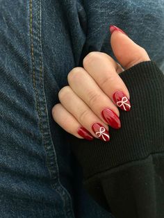 "Obsessed with these red Christmas nails that feature a cute bow detail on two nails! Perfect for the holidays, these nails add a festive and stylish touch to your Christmas look. Whether you're getting ready for a holiday party or just want to feel festive, these nails are a must-try! 🎄💅                                        Credits: @kaaaaiiitttt Xmas Nails Mistletoe, Gel Nail Inspo Christmas, Nail Inspiration December, Red Subtle Christmas Nails, Red Hair Christmas Aesthetic, Nails For The Holidays Seasons, Red Christmas Nails Aesthetic, Christmas Now Nails, Nails Winter Inspiration