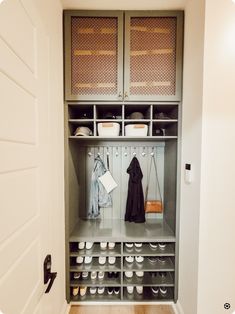 an organized closet with shoes and coats on the shelves, along with other storage items