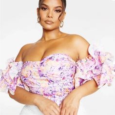 Brand New With Tag Floral Girly Off The Shoulder Top. The Ruffle Sleeves Are Very Romantic, It Zips Up The Back And Gives A Corset Vibe. Pretty Little Thing Size 20 Off-shoulder Floral Print Party Blouse, Sleeveless Lavender Ruffled Top, Trendy Purple Tops For Brunch, Chic Lavender Top With Ruffles, Chic Lavender Tops With Ruffles, Summer Floral Print Purple Blouse, Chic Lavender Ruffled Top, Summer Purple Floral Print Blouse, Fitted Purple Floral Print Top