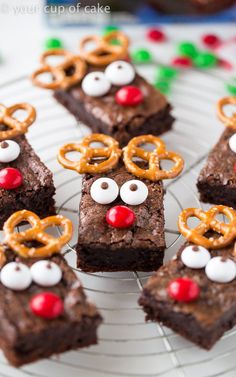 some brownies with pretzels and reindeer noses on them