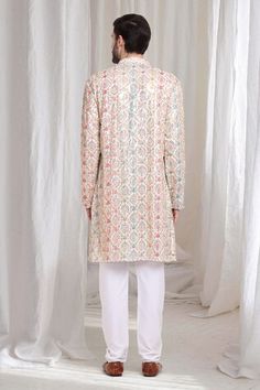 Ivory cotton kurta with multi color thread and sequins embroidery. Paired with solid churidaar. - Aza Fashions Embroidered Off White Cotton Sherwani, Embroidered Off-white Cotton Sherwani, Designer Cream Kurta With Printed Motifs, Cream Kurta With Printed Motifs For Wedding, Designer Multicolor Bandhgala With Chikankari Embroidery, Festive Cream Kurta With Printed Motifs, White Cotton Sherwani With Cutdana, Multicolor Chikankari Embroidery Bandhgala For Diwali, Multicolor Chikankari Bandhgala For Diwali