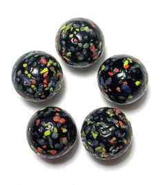 four black and multicolored confetti covered beads