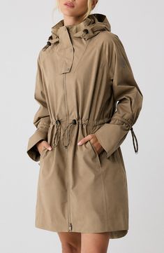 Travel confidently and comfortly in wet weather with this waterproof rain jacket designed for easy packing and breathability. 35" front length; 38" back length (size Medium) Drawcord-toggle hood Drawcord-toggle waist Waterproof Lined 100% polyester Machine wash, tumble dry Imported Women’s Raincoat, Stylish Raincoats For Women, Rain Jacket Aesthetic, Rain Coat Outfits, Rain Jacket Outfit, Womens Rain Jacket, Stylish Raincoats, Raincoat Outfit, Jacket Outfit Women