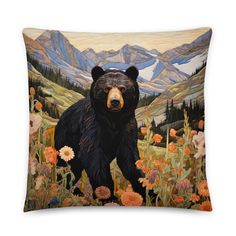 a painting of a black bear standing in a field of wildflowers with mountains in the background