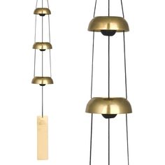 three brass colored lamps hanging from the ceiling