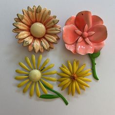 Lot of three in preowned vintage condition with some small chips/cracks to paint.  Largest measures approximately 3" tall Luxury Enamel Flower Brooches, Retro Flower Brooches For Collectors, Vintage Enamel Flower Brooch, Vintage Yellow Flower Brooch, Vintage Pink Collectible Brooches, Daisy Vintage, Christmas Cd, 70s Mod, Vintage Daisy